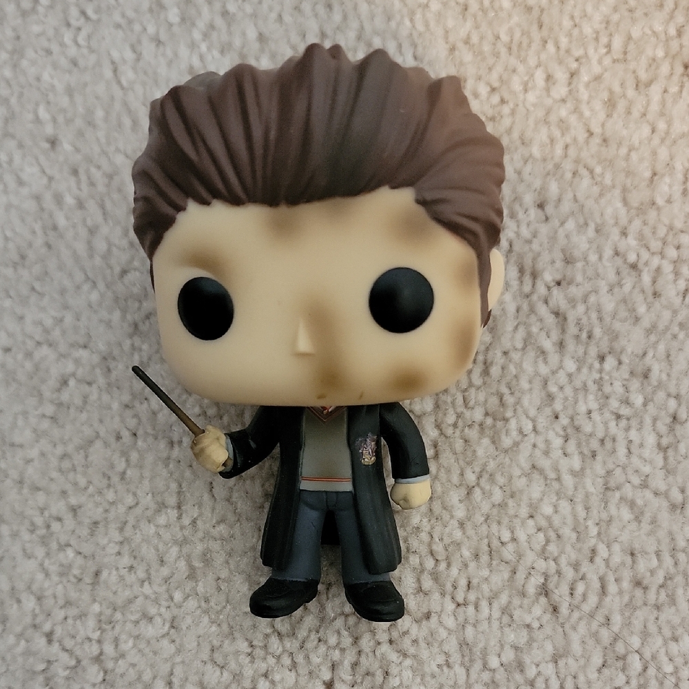 Funko Pop Figure with Black Coat and Brown Hair